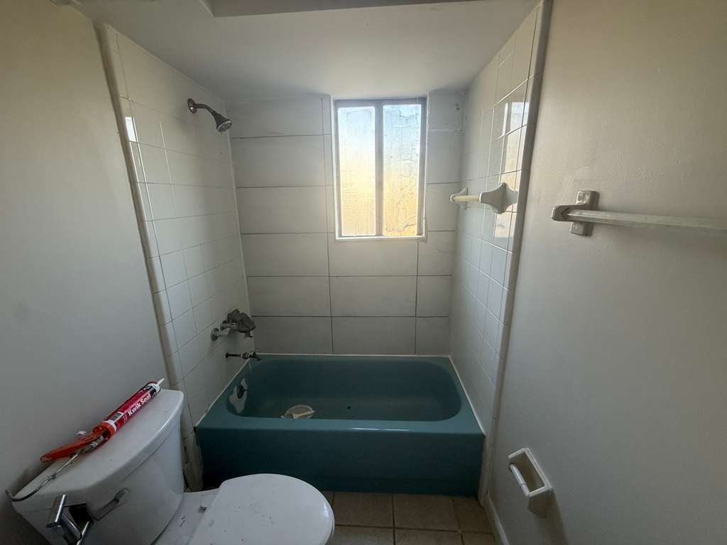 Bathroom before tub reglazing and turn cleaning